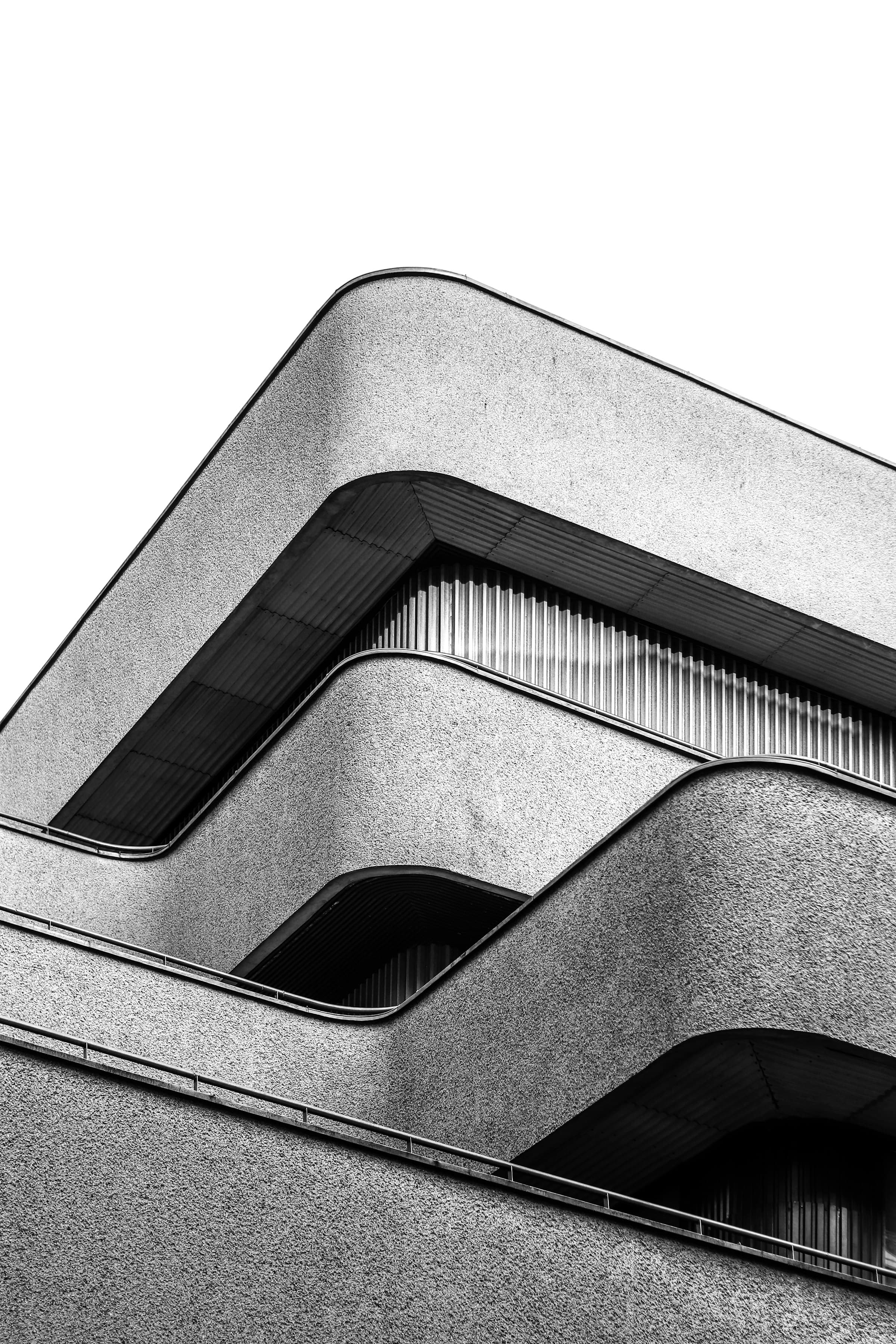 Curved concrete balconies rising against the sky